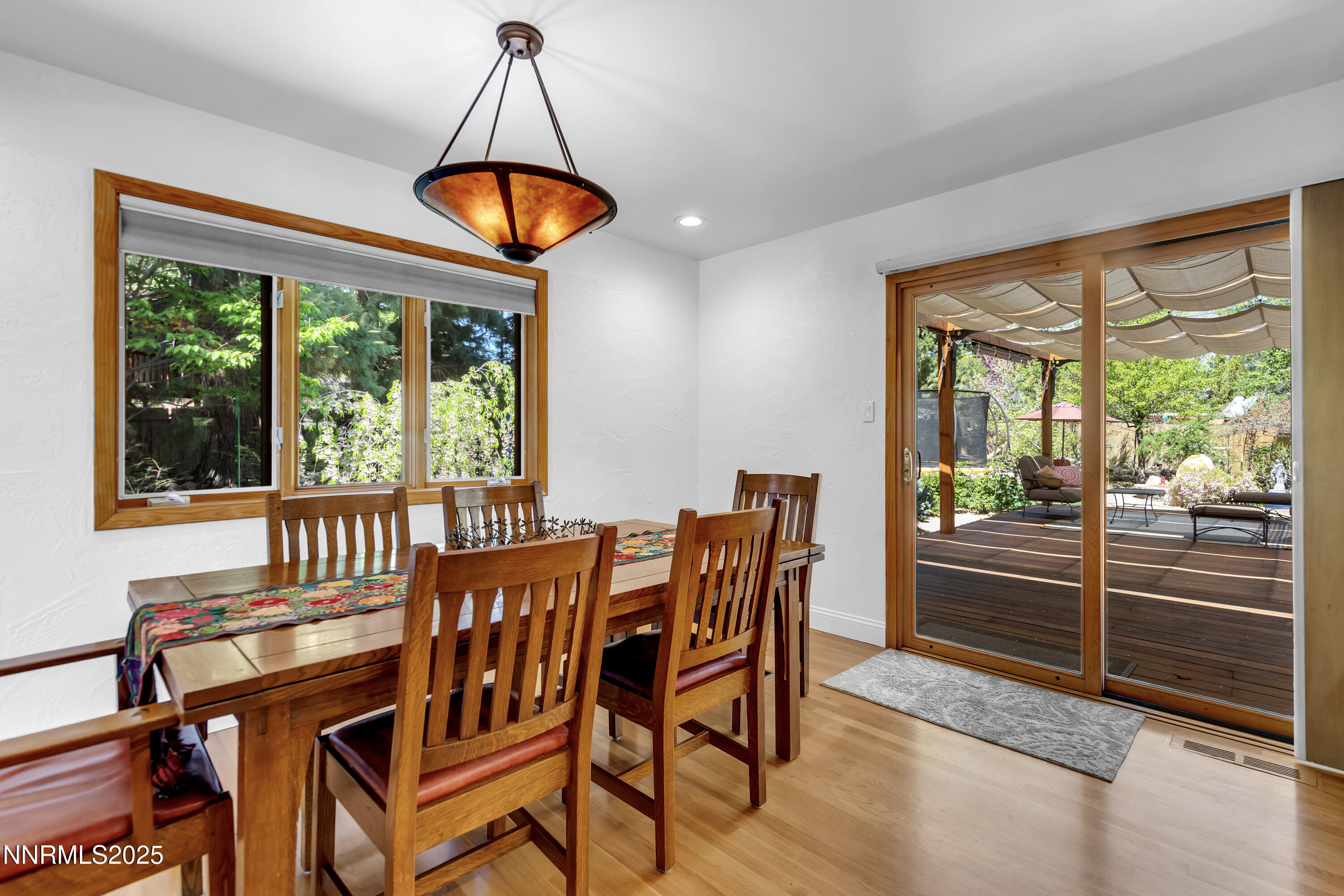 1145 Alpine Circle Reno, NV 89509 - Photo 13 of 36 a view of a dining room with furniture window and outside view