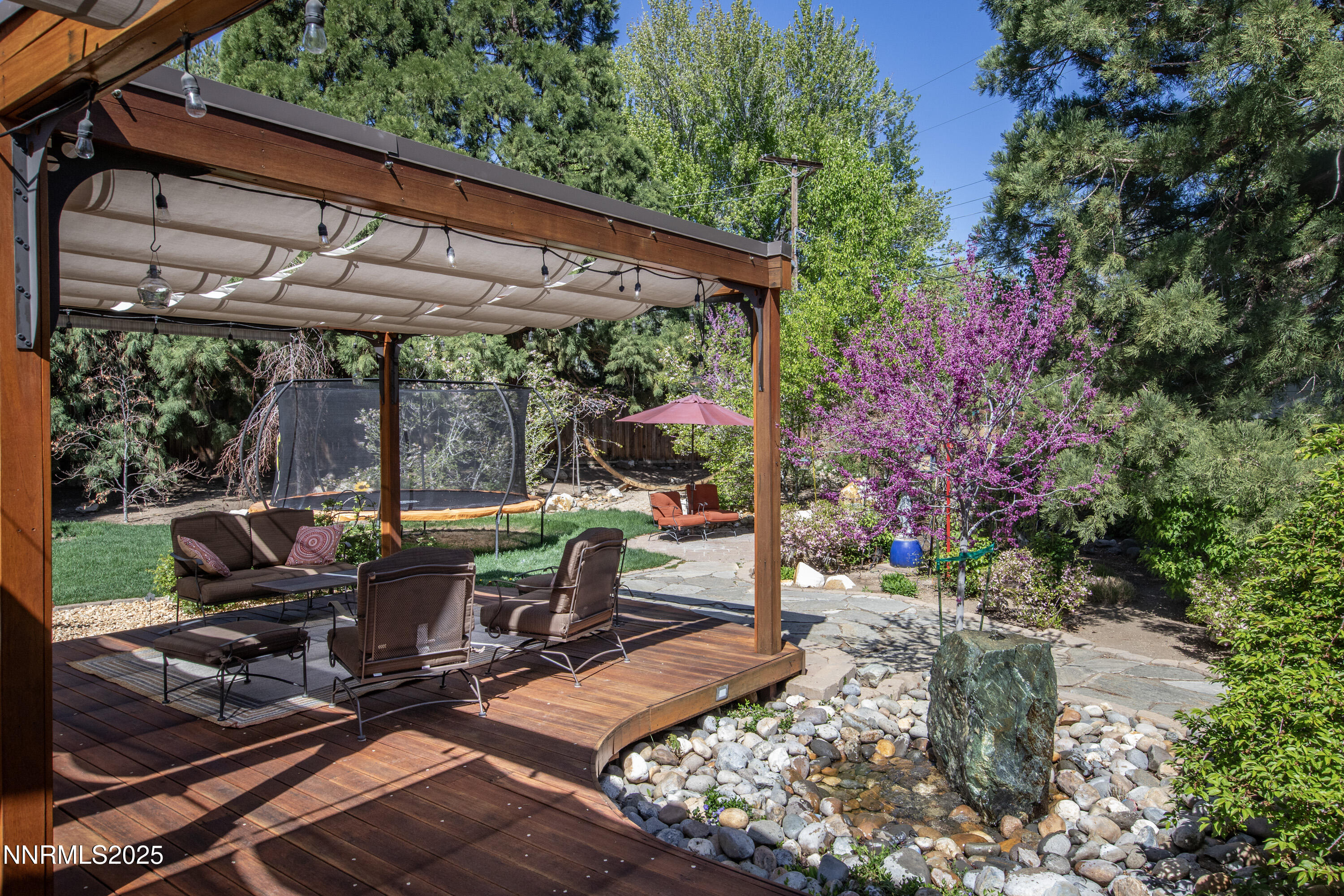 1145 Alpine Circle Reno, NV 89509 - Photo 2 of 36 a view of a patio with table and chairs potted plants