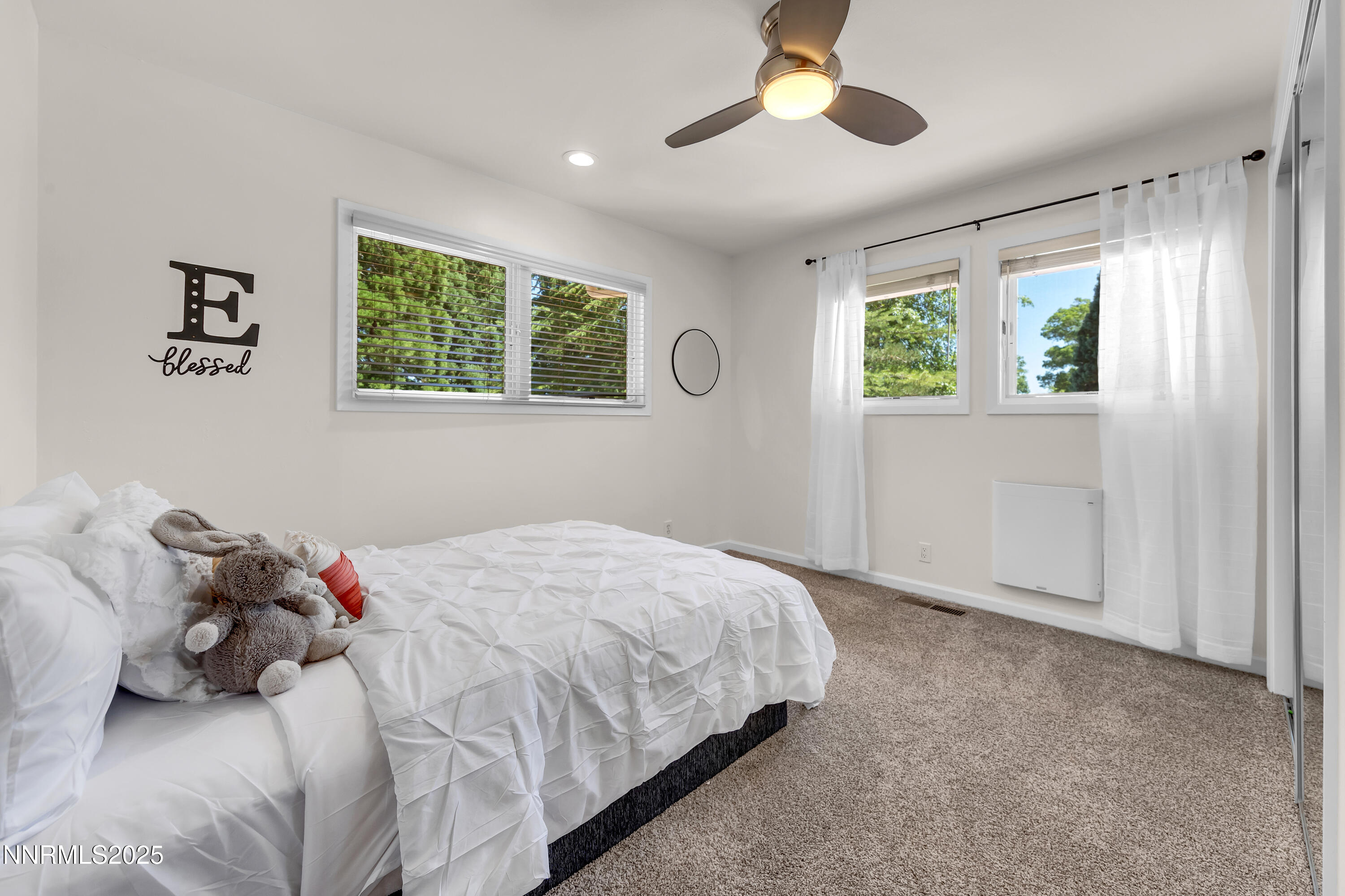 1145 Alpine Circle Reno, NV 89509 - Photo 24 of 36 a bedroom with a bed and a window