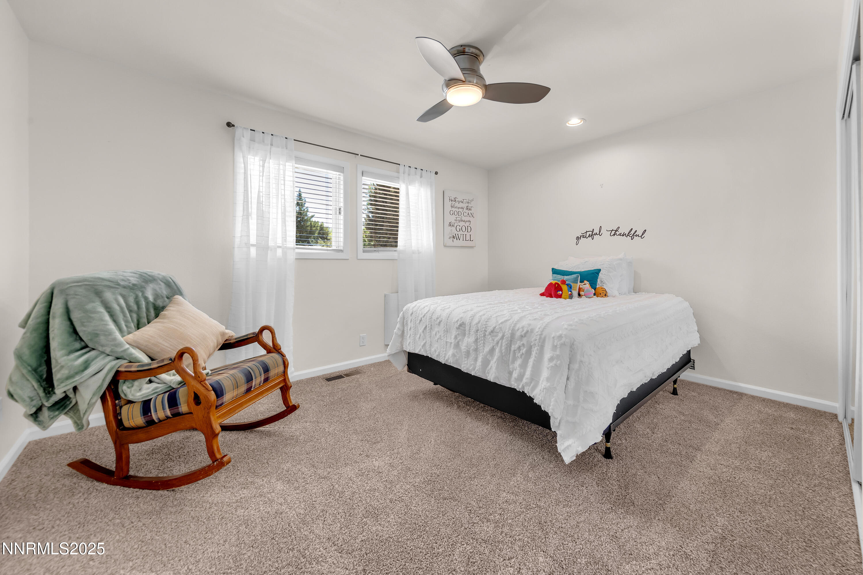 1145 Alpine Circle Reno, NV 89509 - Photo 25 of 36 a bedroom with a bed and window
