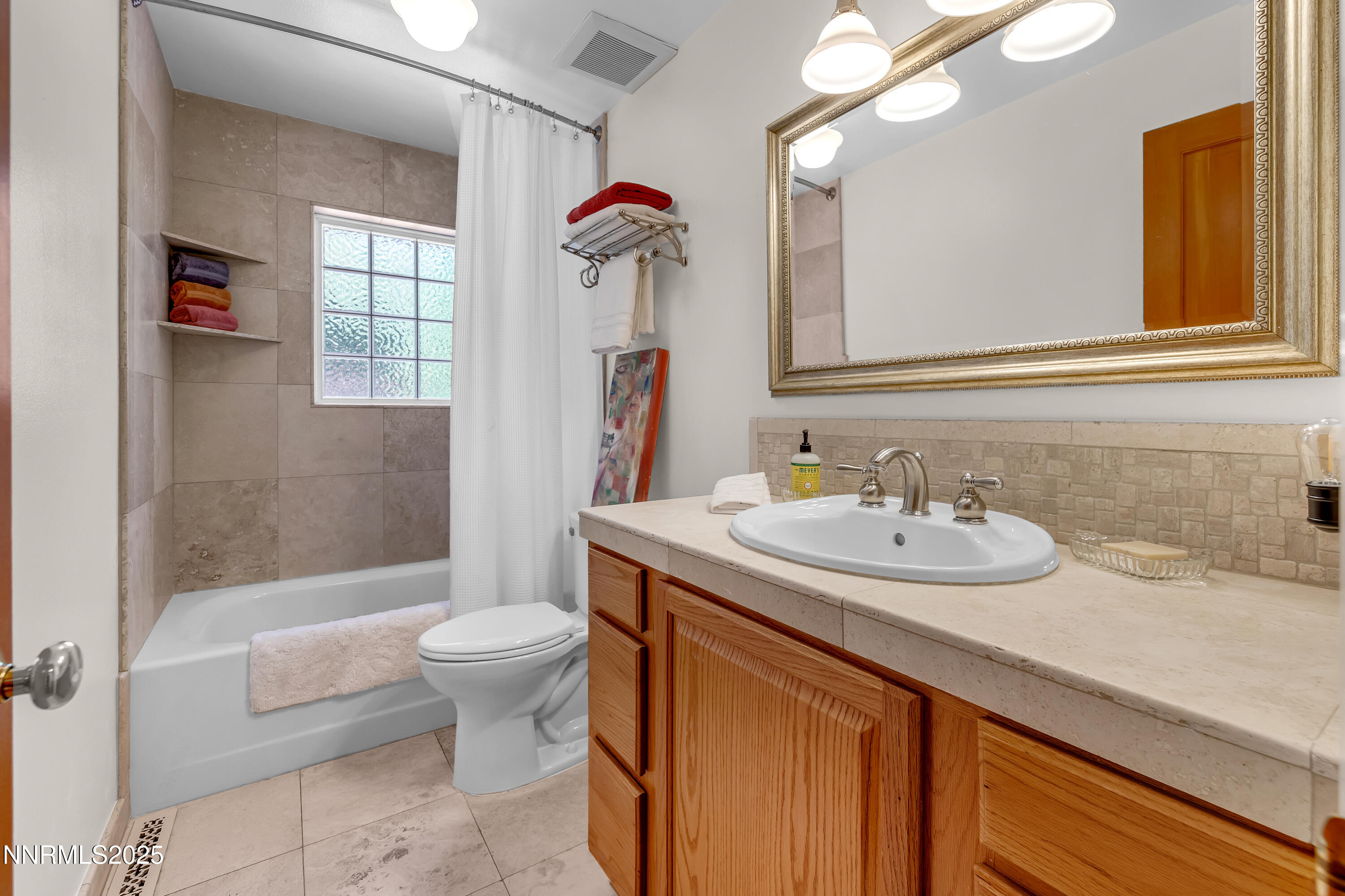 1145 Alpine Circle Reno, NV 89509 - Photo 26 of 36 a bathroom with a sink and a mirror
