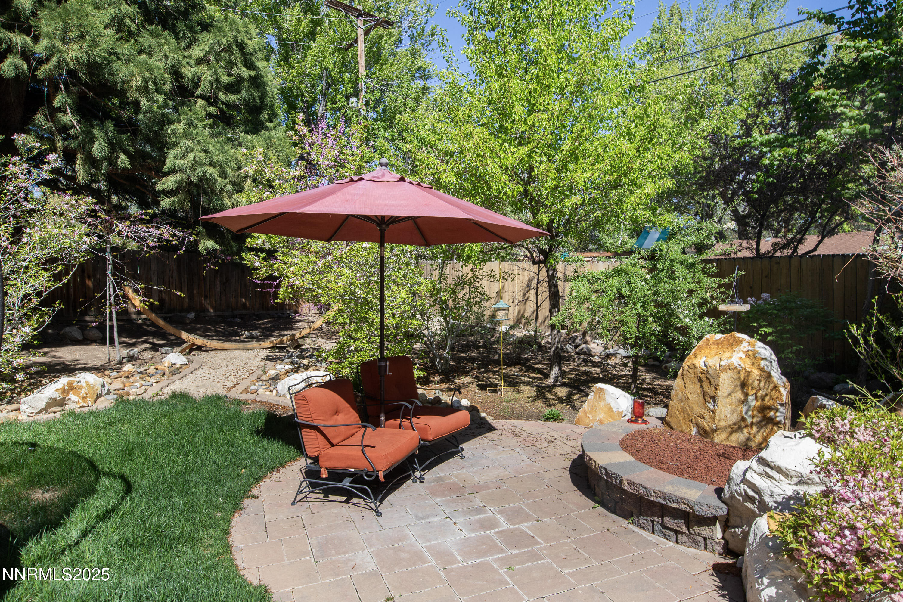 1145 Alpine Circle Reno, NV 89509 - Photo 28 of 36 a backyard of a house with table and chairs