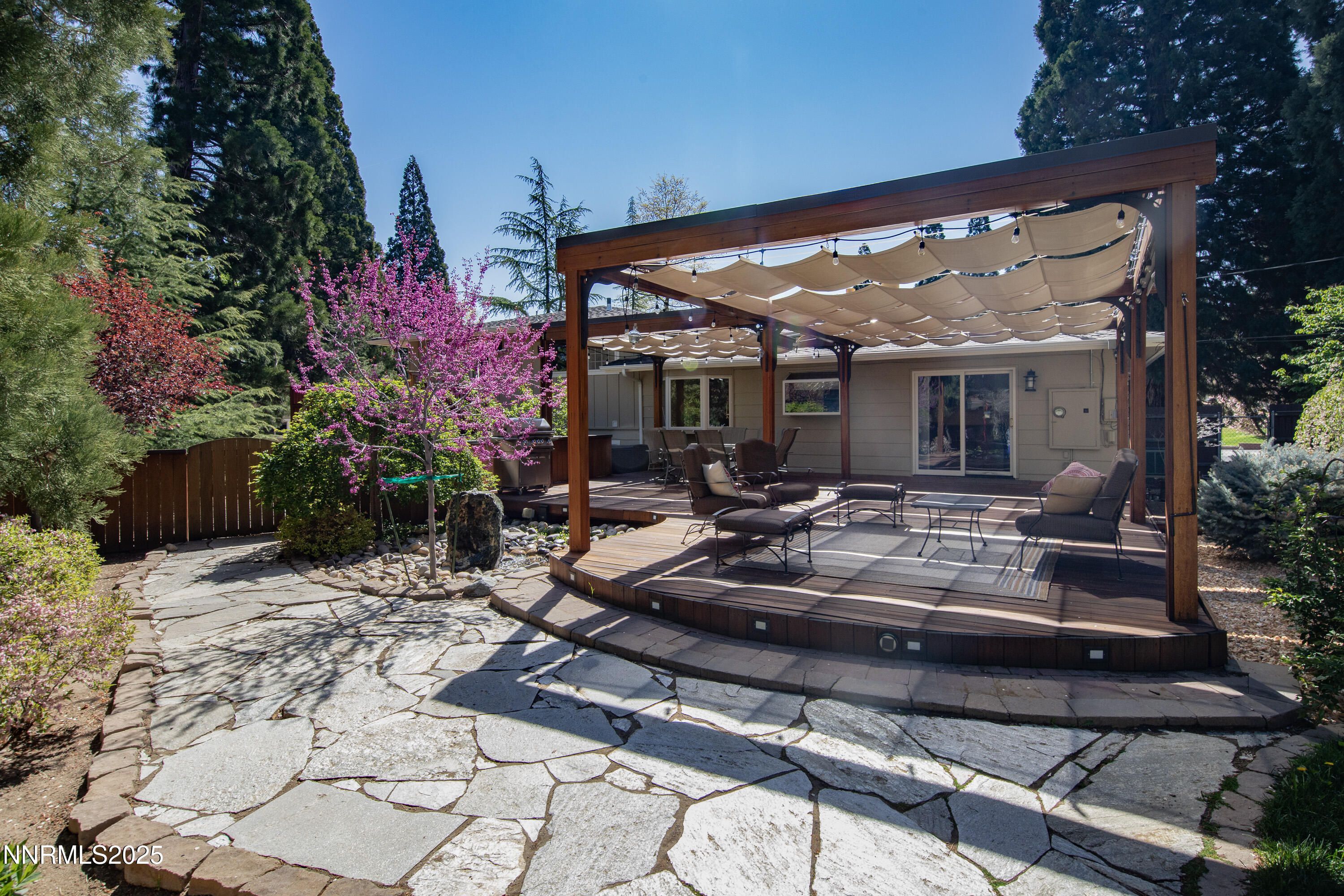 1145 Alpine Circle Reno, NV 89509 - Photo 32 of 36 a view of a patio with table and chairs and potted plants