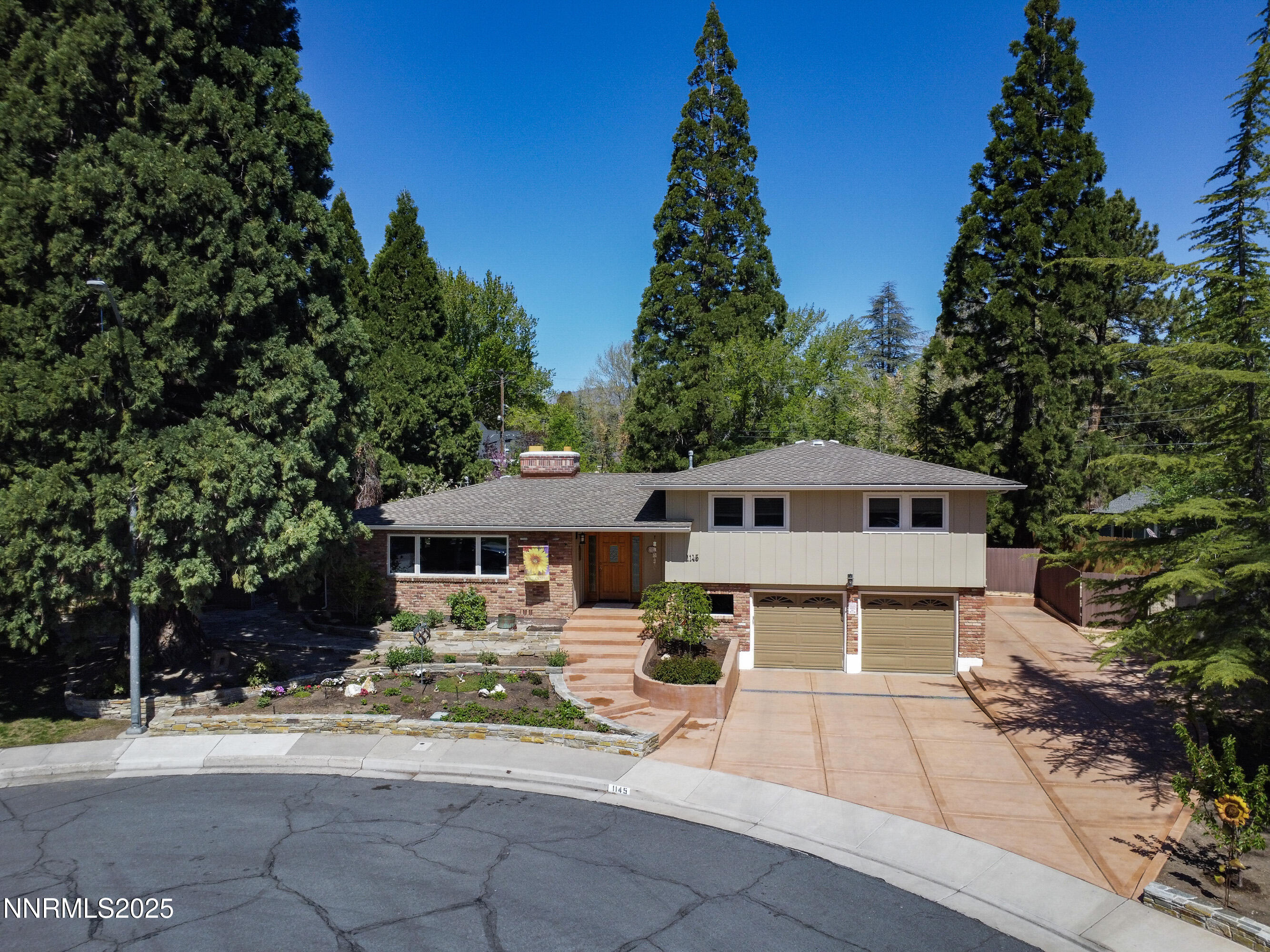 1145 Alpine Circle Reno, NV 89509 - Photo 36 of 36 a front view of a house with a yard