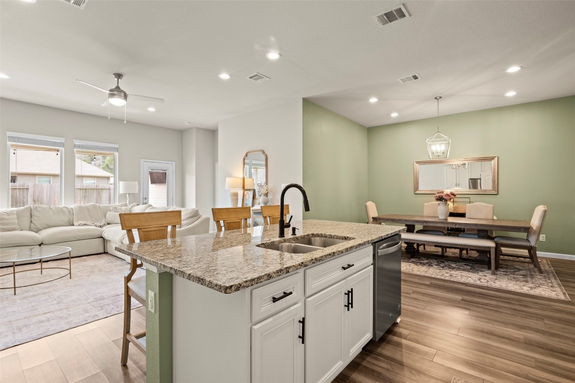 14239 Volcano Perch Drive Conroe, TX 77384 - Photo 15 of 39 You'll love how these rooms come together to create a great open flowing space! Natural light fills the area, making it cheerful and bright!