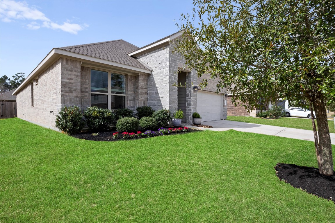 14239 Volcano Perch Drive Conroe, TX 77384 - Photo 2 of 39 a view of a house with backyard and garden
