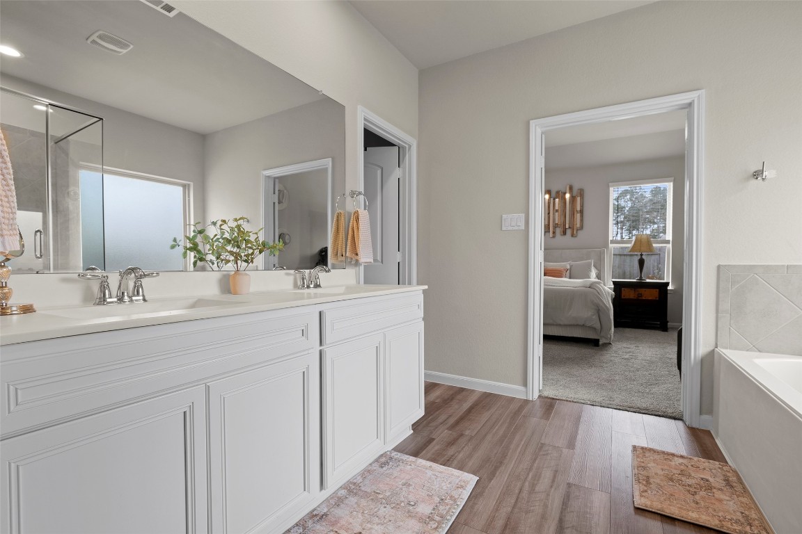 14239 Volcano Perch Drive Conroe, TX 77384 - Photo 22 of 39 Spacious double vanity and large walk-in closet!