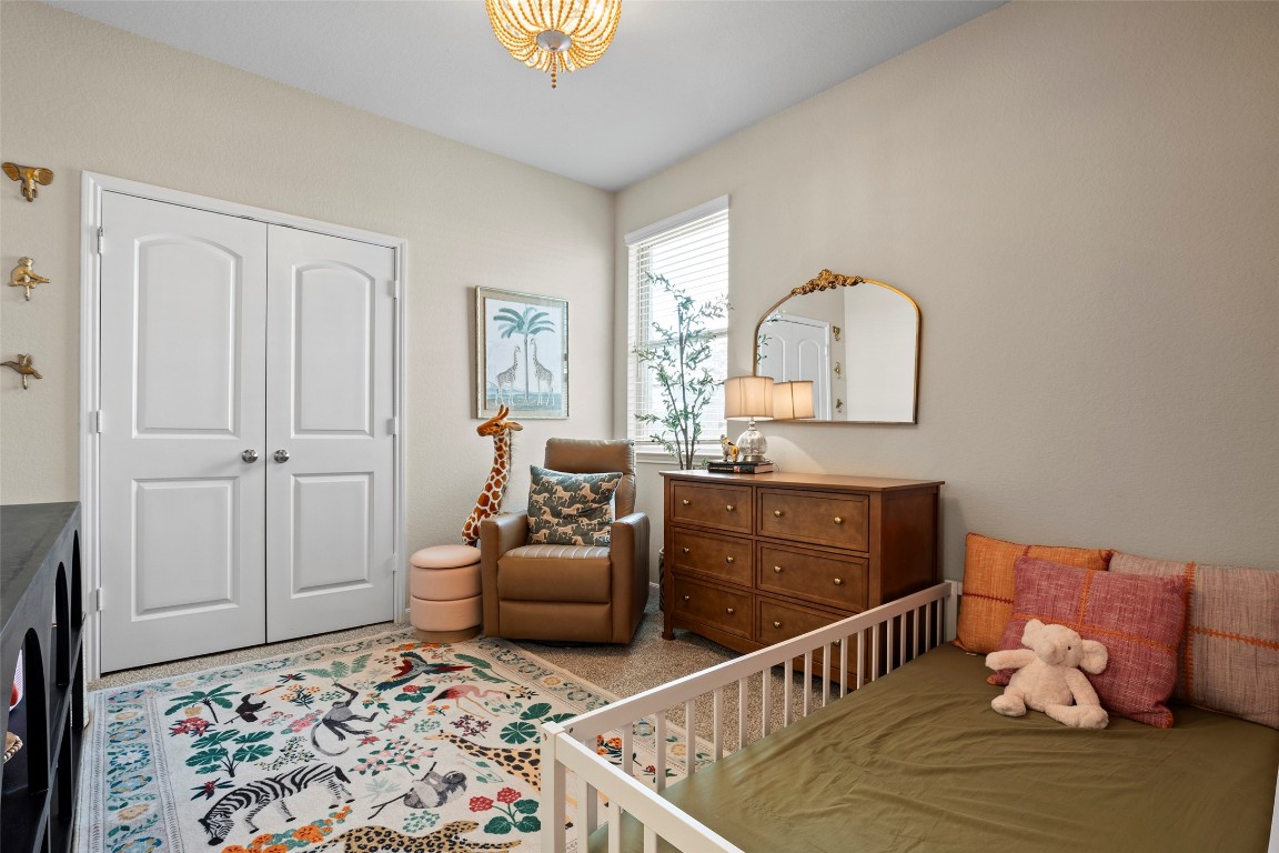 14239 Volcano Perch Drive Conroe, TX 77384 - Photo 23 of 39 a bedroom with furniture and a window
