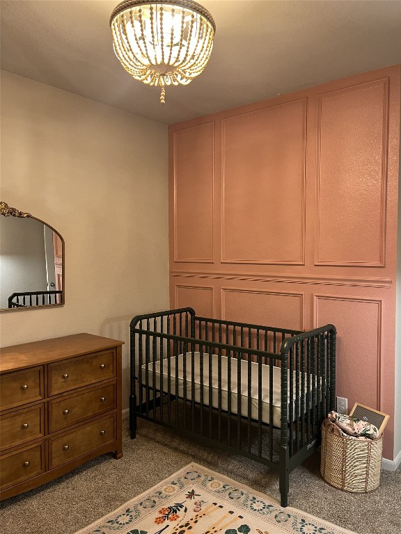 14239 Volcano Perch Drive Conroe, TX 77384 - Photo 24 of 39 a room with a baby crib and a dresser