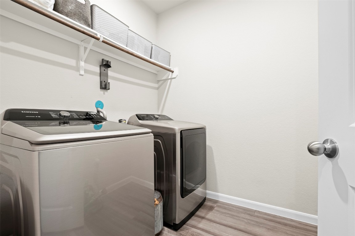 14239 Volcano Perch Drive Conroe, TX 77384 - Photo 26 of 39 a utility room with dryer and washer