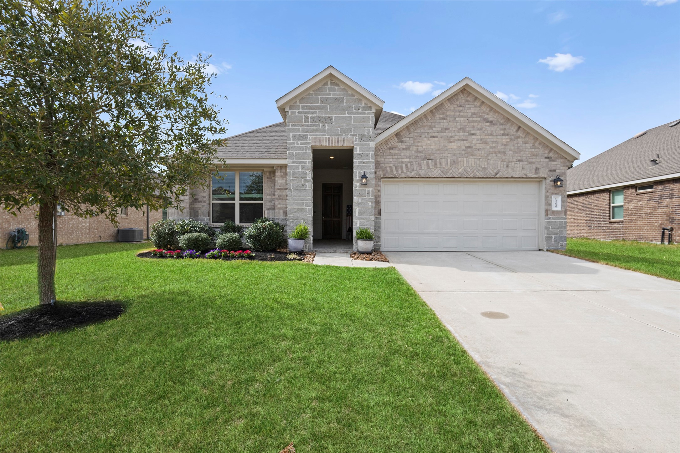 14239 Volcano Perch Drive Conroe, TX 77384 - Photo 30 of 39 a front view of house with yard and green space
