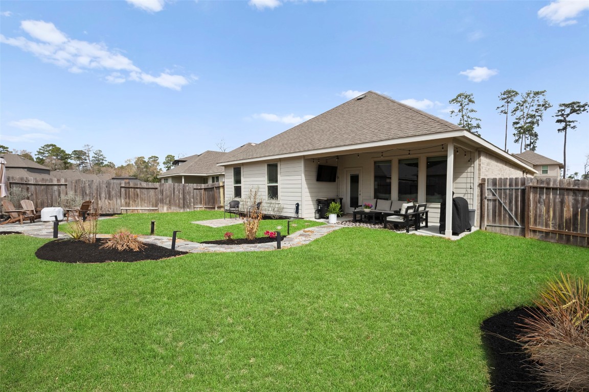 14239 Volcano Perch Drive Conroe, TX 77384 - Photo 31 of 39 a view of outdoor space yard and patio