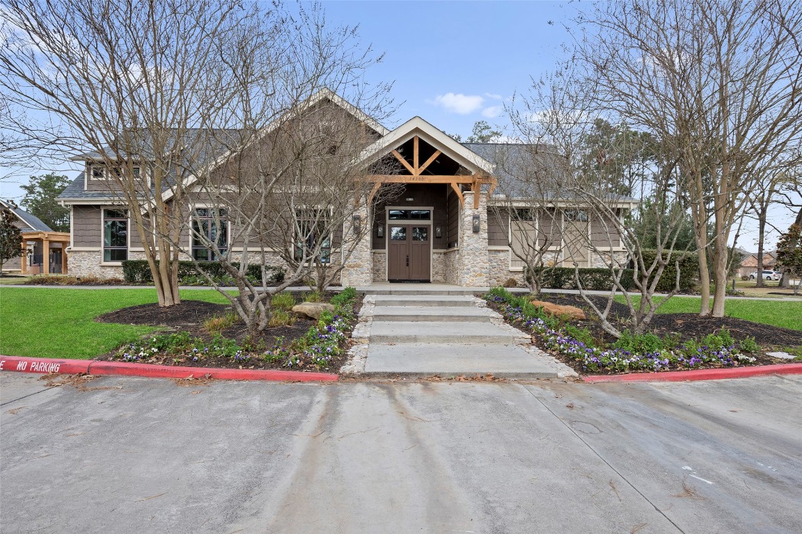 14239 Volcano Perch Drive Conroe, TX 77384 - Photo 38 of 39 a front view of house with yard and green space