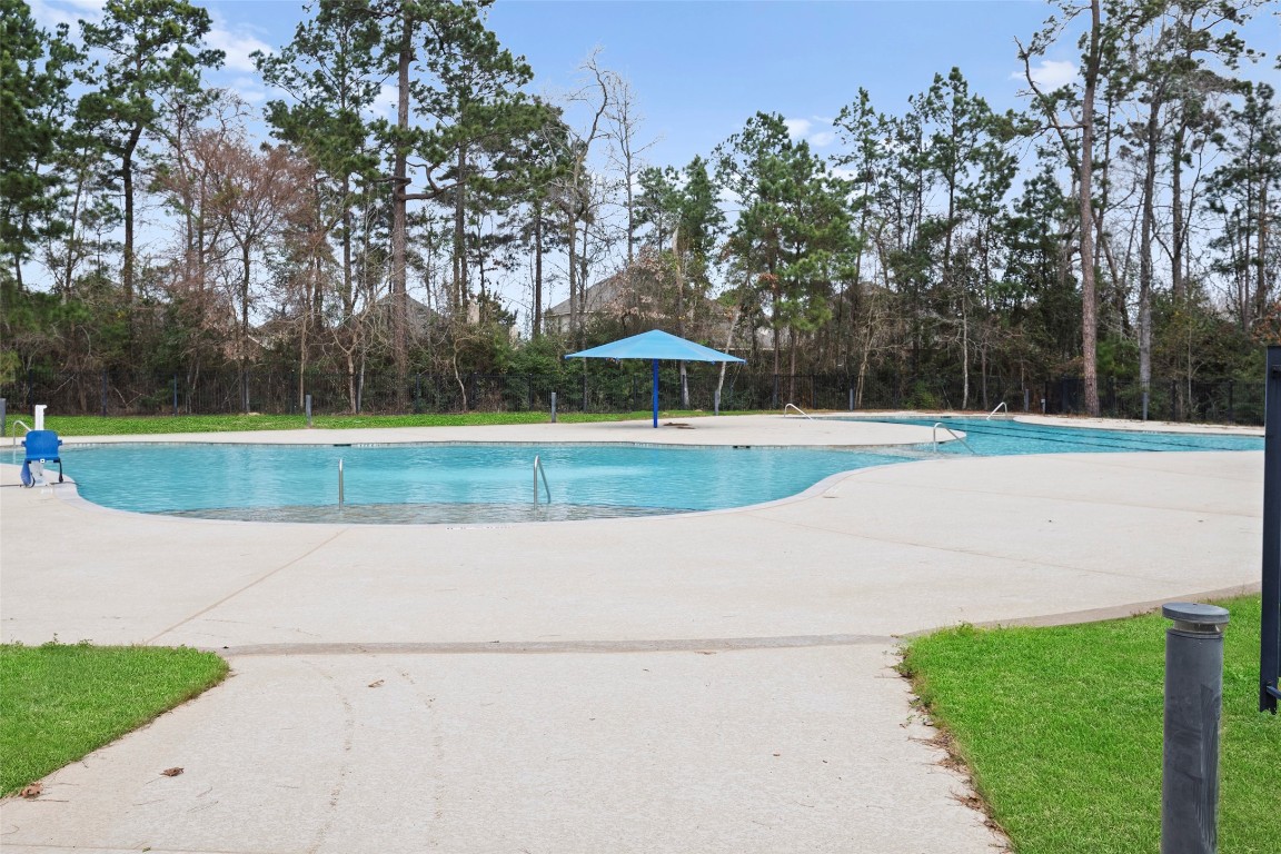 14239 Volcano Perch Drive Conroe, TX 77384 - Photo 39 of 39 The pool is located near the lodge - perfect to enjoy on our hot summer days! There are also playgrounds for young children nearby.