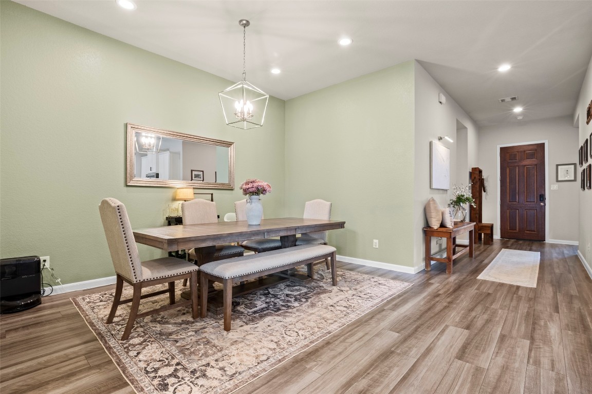 14239 Volcano Perch Drive Conroe, TX 77384 - Photo 8 of 39 a view of a dining room with furniture and wooden floor