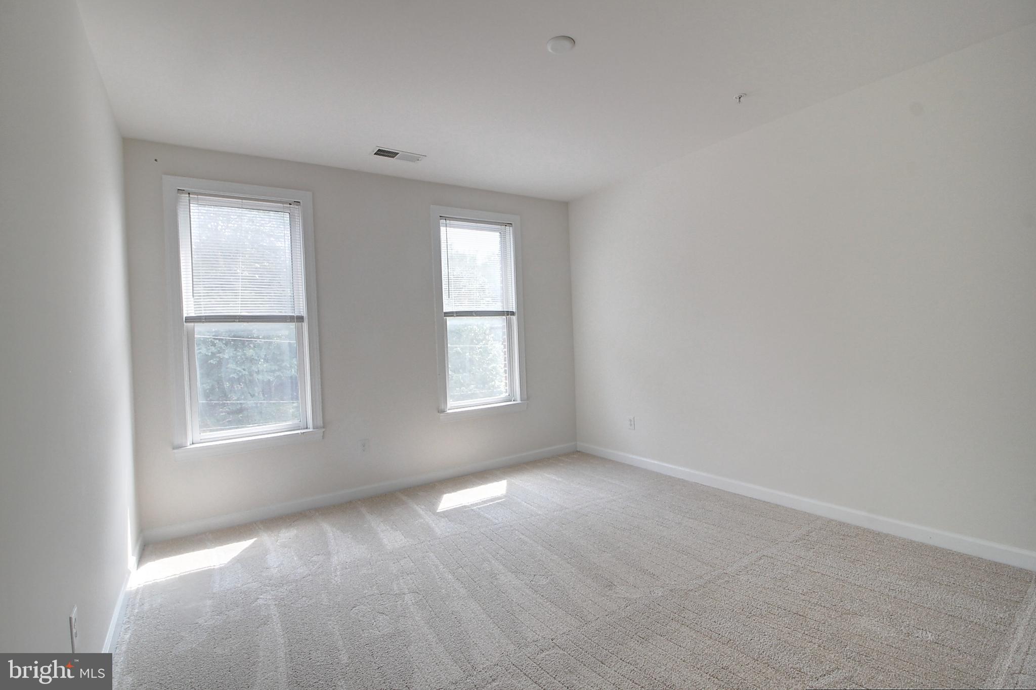35 East All Saints Street, Unit 321 Frederick, MD 21701 - Photo 12 of 17 an empty room with windows