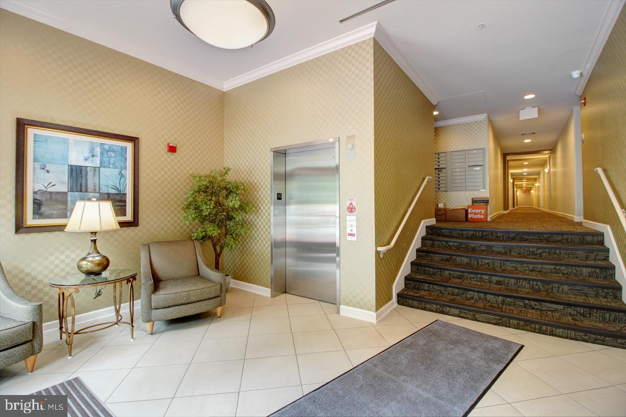 35 East All Saints Street, Unit 321 Frederick, MD 21701 - Photo 17 of 17 a living room with furniture and a view of bedroom