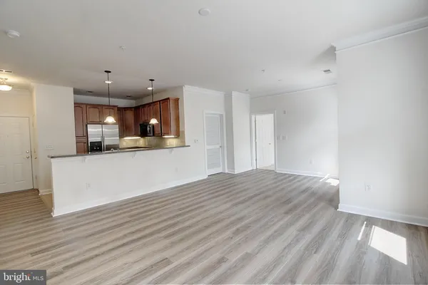 a view of kitchen and wooden floor