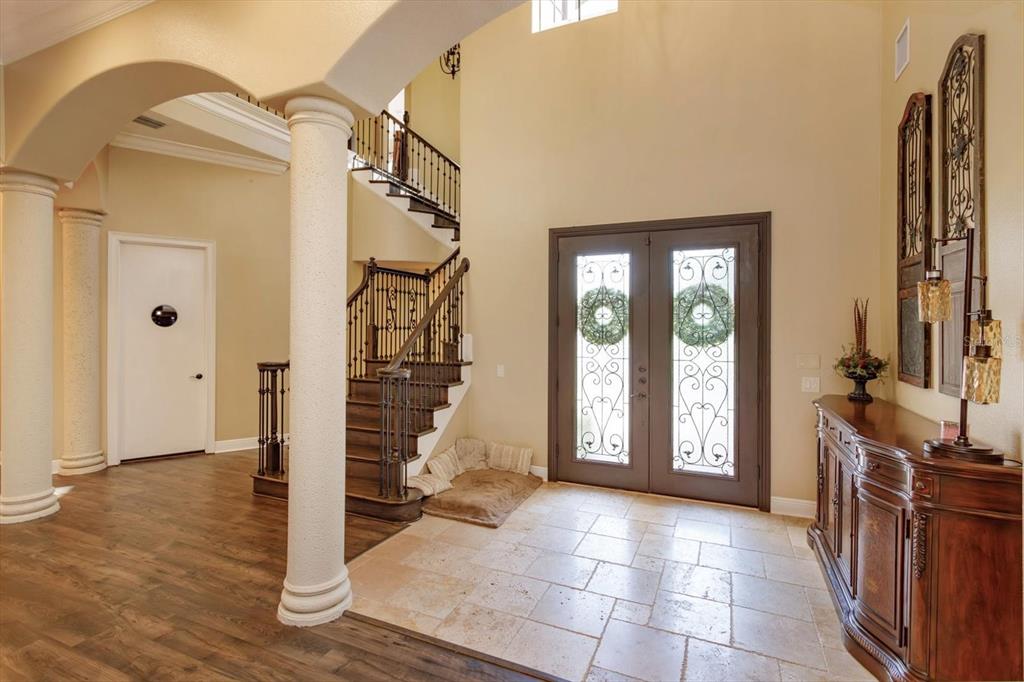 5719 Emerson Pointe Way Orlando, FL 32819 - Photo 2 of 50 a view of an entryway with a livingroom