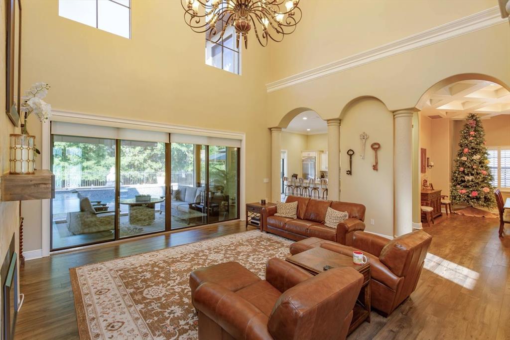 5719 Emerson Pointe Way Orlando, FL 32819 - Photo 4 of 50 a living room with furniture and a large window