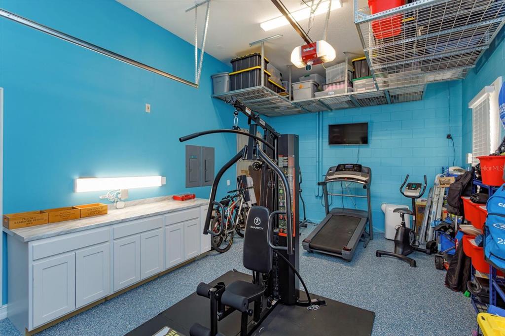 5719 Emerson Pointe Way Orlando, FL 32819 - Photo 47 of 50 a view of a room with gym equipment