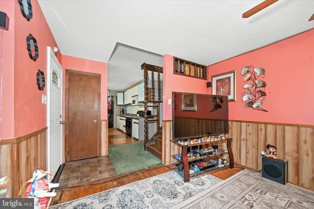 a bedroom with furniture and a rug