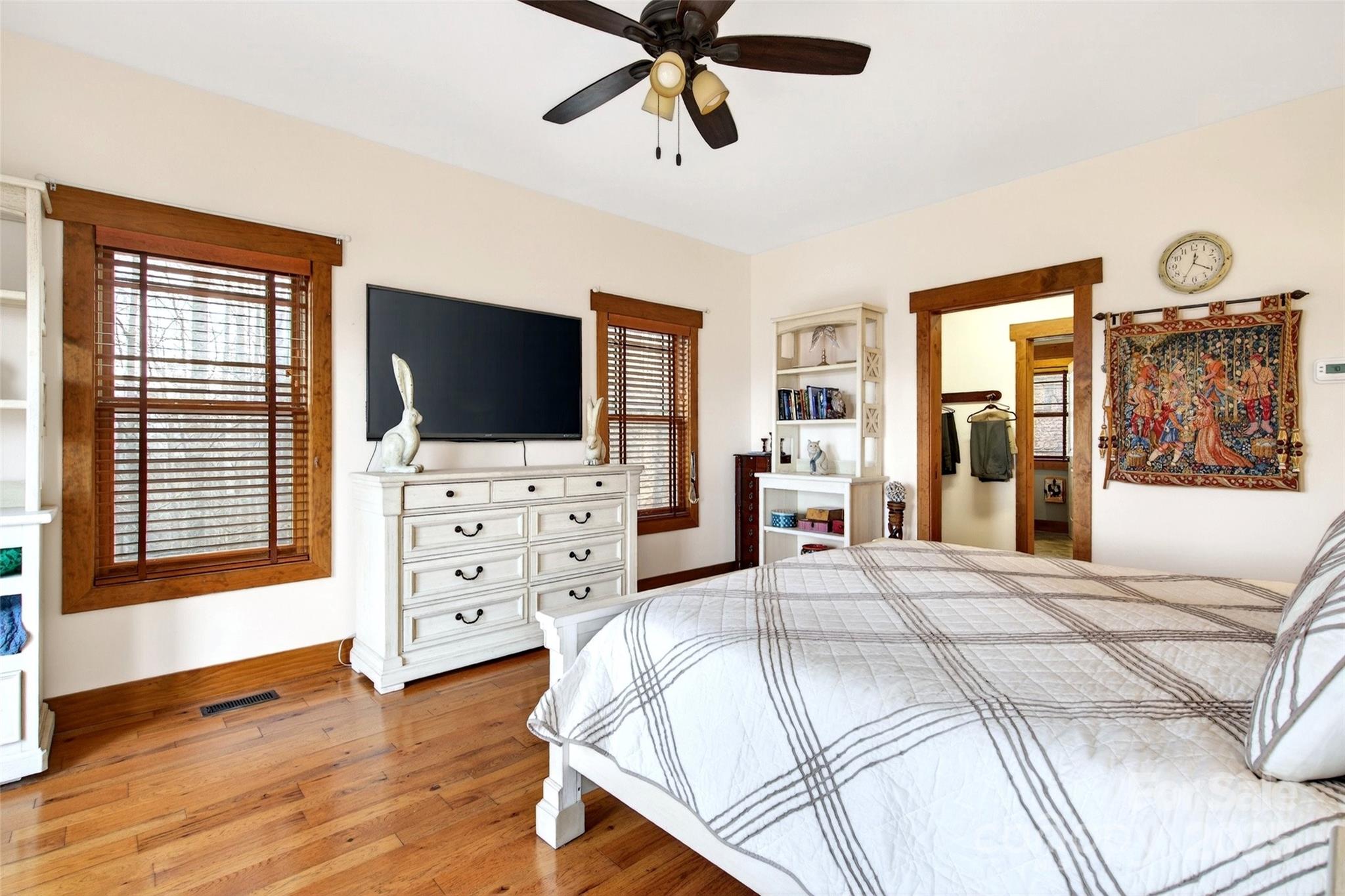 242 Lakeview Trail Nebo, NC 28761 - Photo 18 of 46 a bedroom with a bed and a flat screen tv