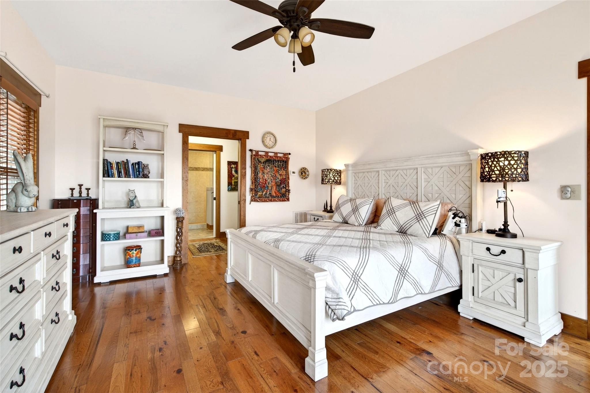 242 Lakeview Trail Nebo, NC 28761 - Photo 19 of 46 a bedroom with a bed and wooden floor