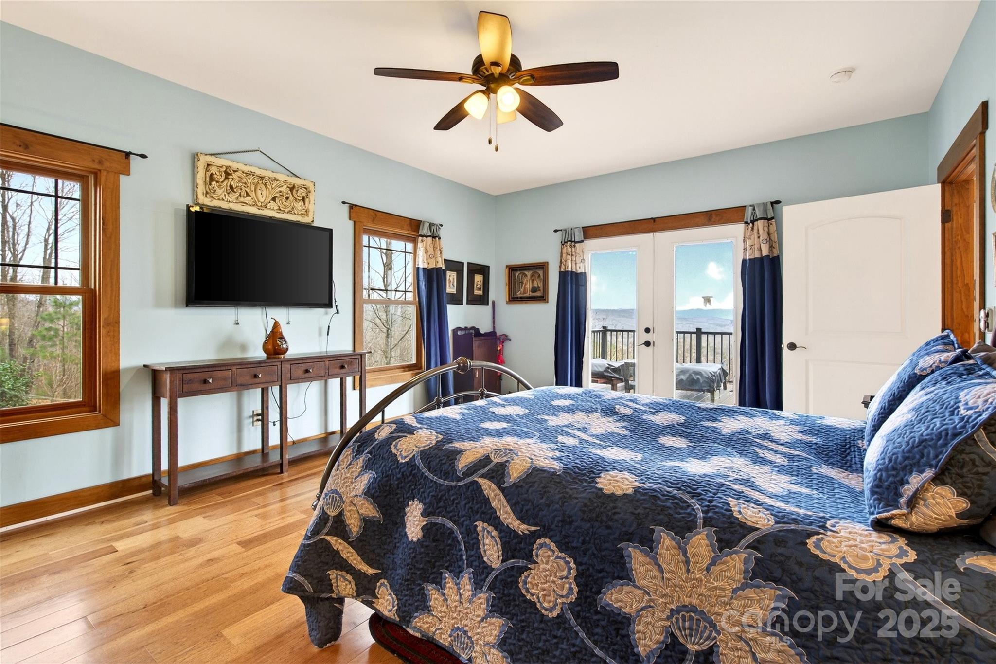 242 Lakeview Trail Nebo, NC 28761 - Photo 24 of 46 a bedroom with a bed and a flat tv screen on dresser