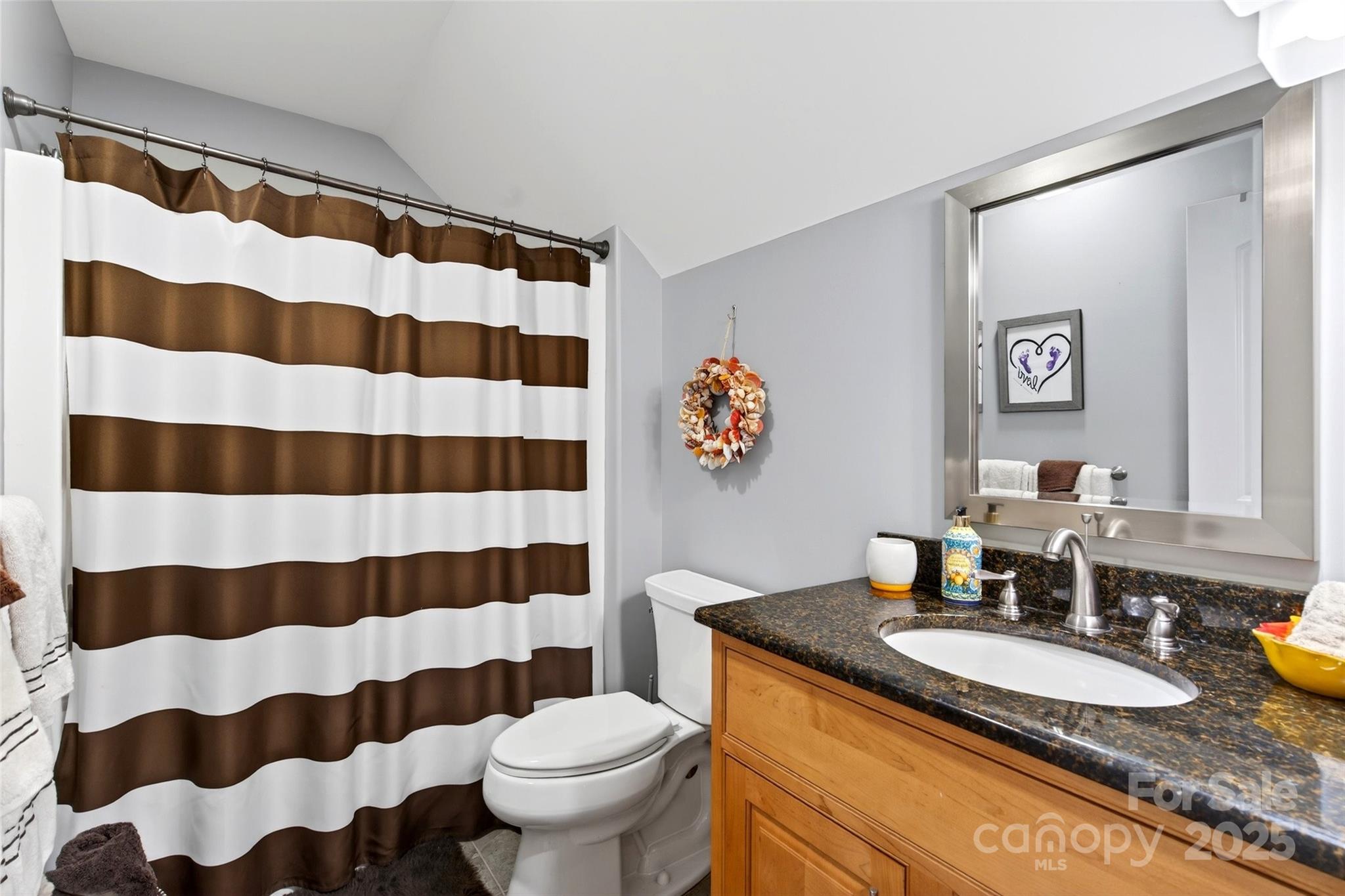 242 Lakeview Trail Nebo, NC 28761 - Photo 29 of 46 a bathroom with a granite countertop sink and a mirror