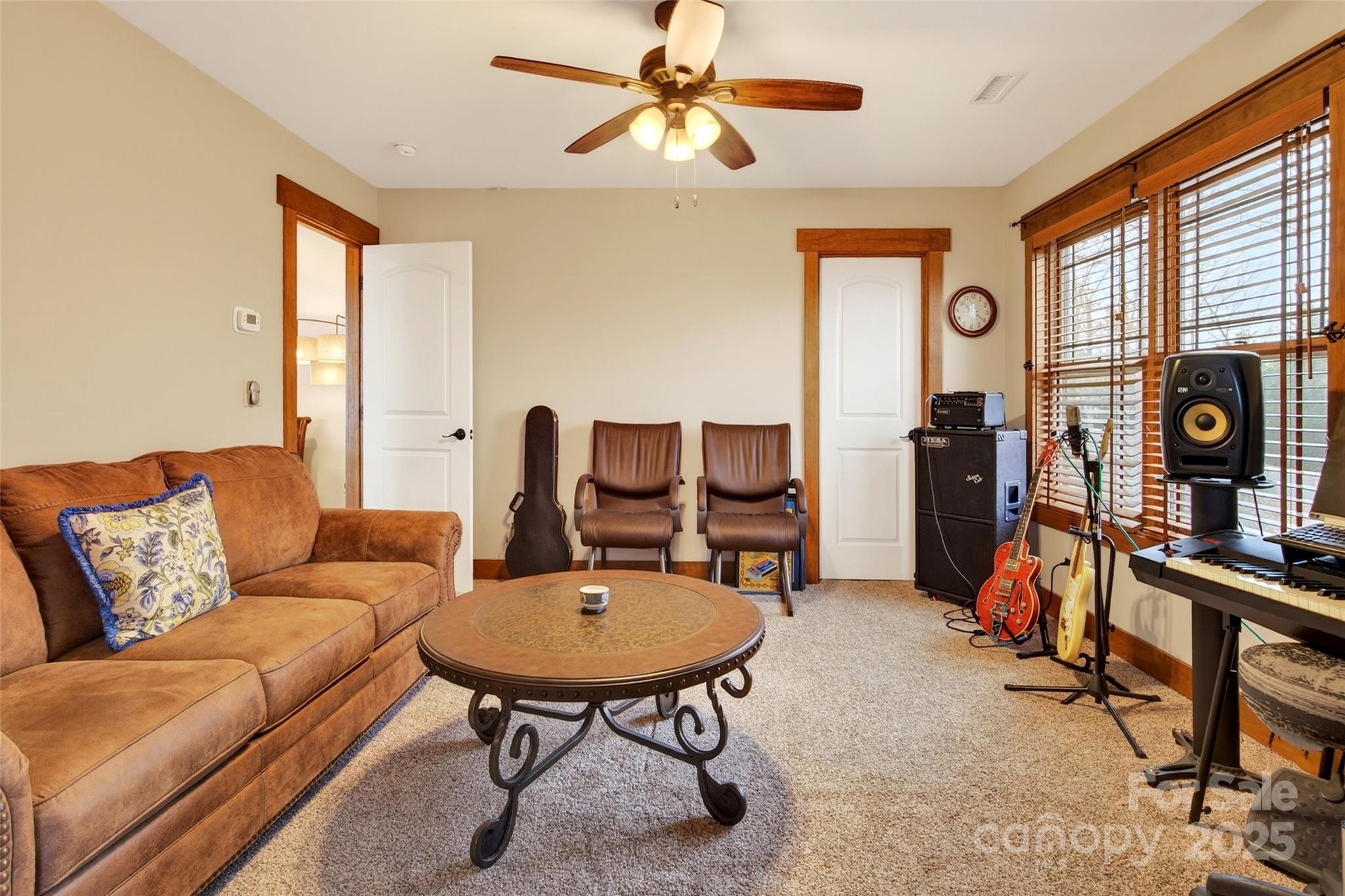 242 Lakeview Trail Nebo, NC 28761 - Photo 33 of 46 a living room with furniture a flat screen tv and a window