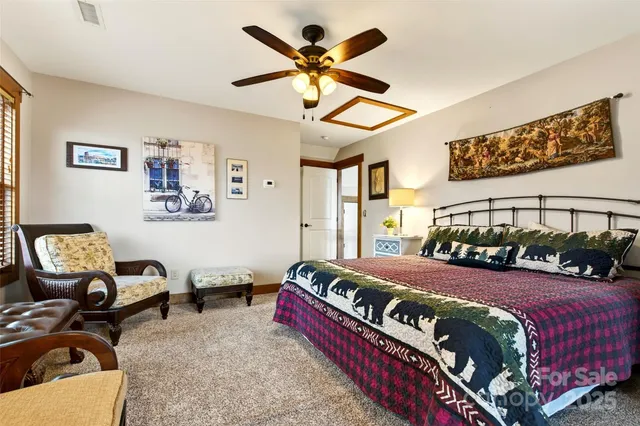 a bedroom with a bed couch and window