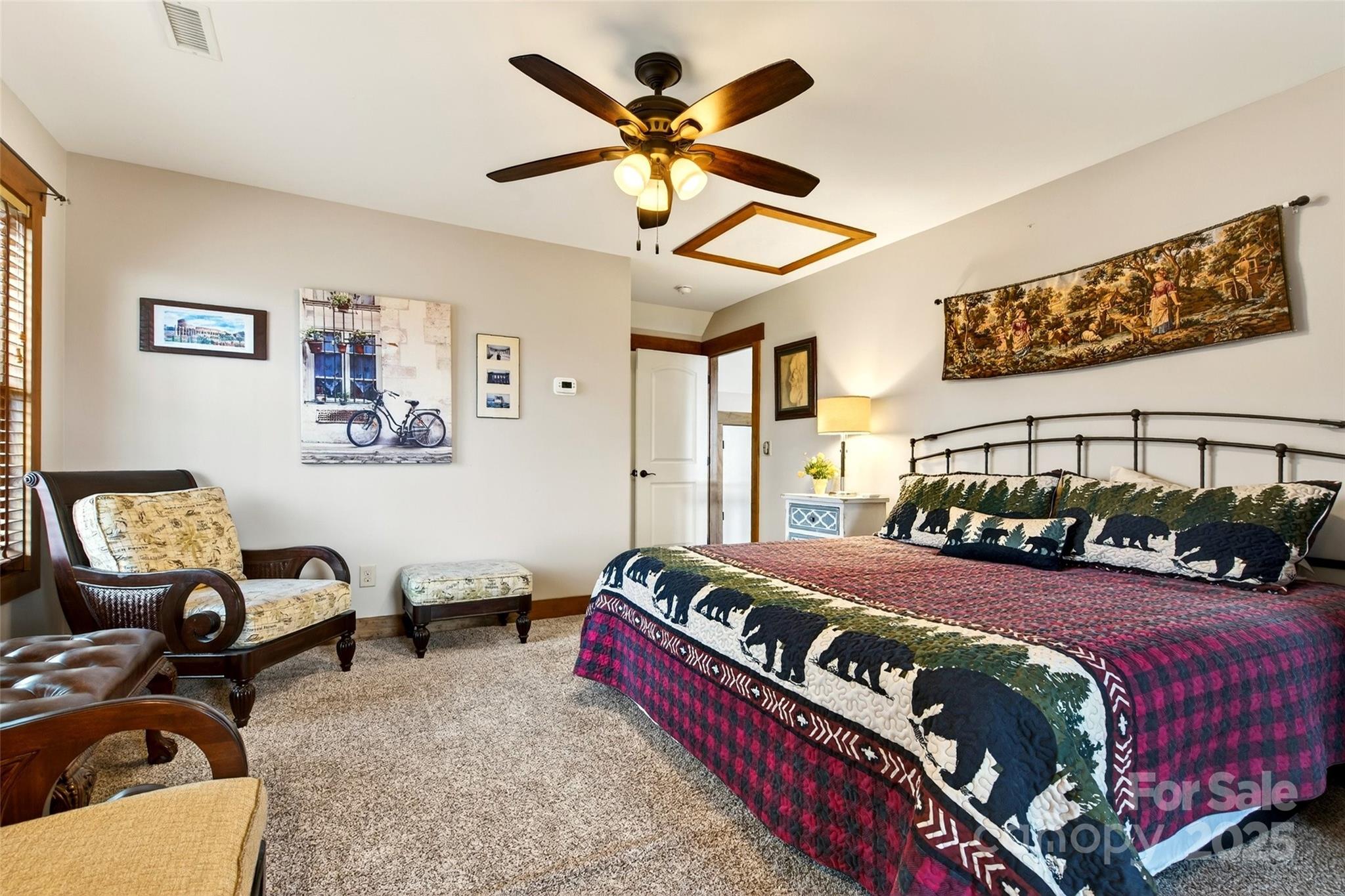 242 Lakeview Trail Nebo, NC 28761 - Photo 35 of 46 a bedroom with a bed couch and window