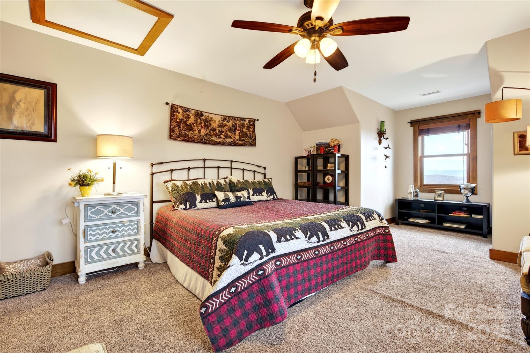 242 Lakeview Trail Nebo, NC 28761 - Photo 37 of 46 a bedroom with a bed and a walk in closet