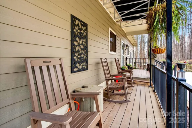 a balcony with table and chairs