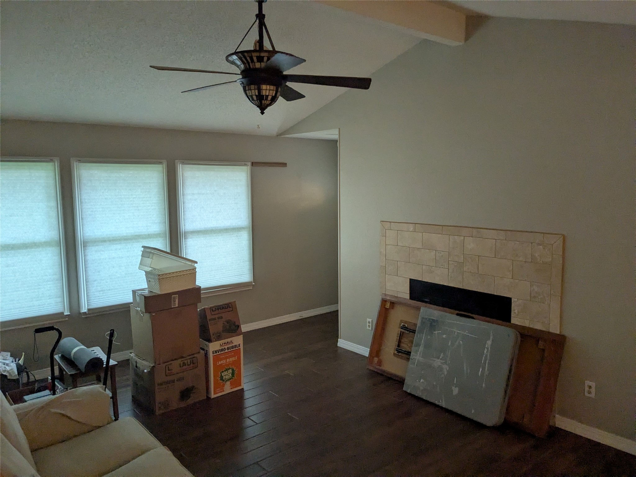 2502 Charla Circle Austin, TX 78728 - Photo 3 of 14 Vast living space features rich wood flooring and a contemporary fireplace focal point.