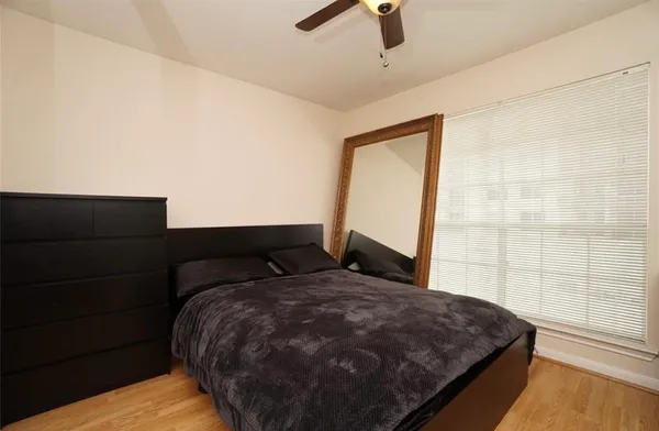 a swimming pool with outdoor seating and plants