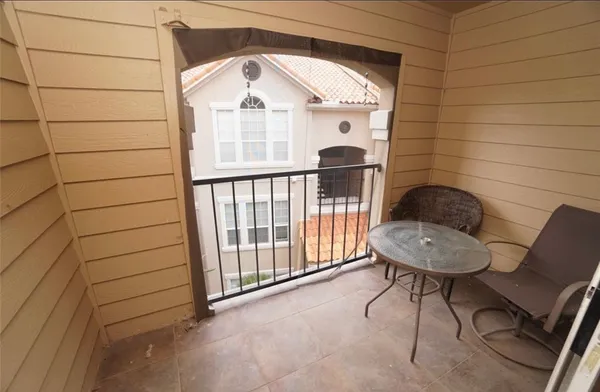 a view of a patio with swimming pool table and chairs