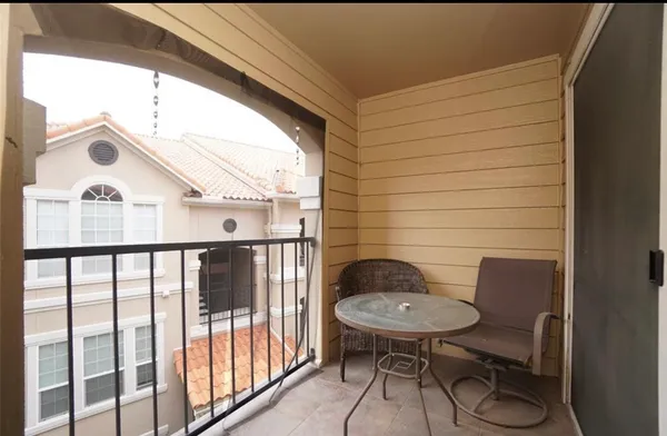 a view of a livingroom with workspace and a window