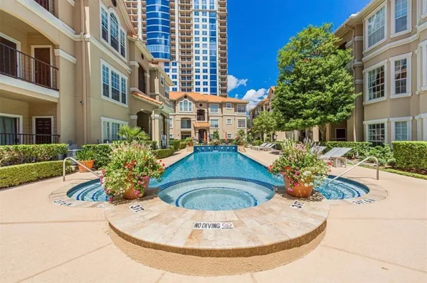 a view of a house with a fountain