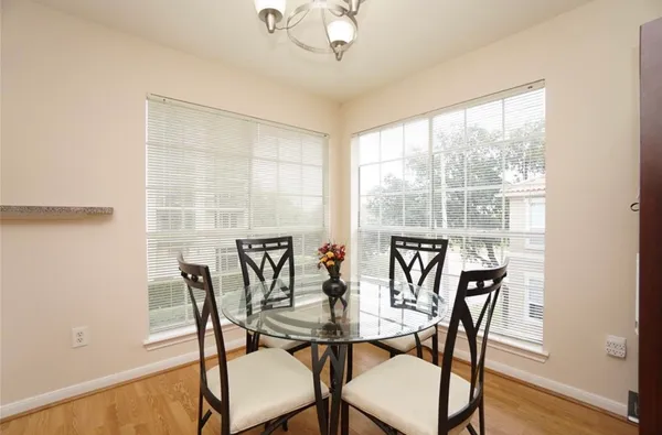 a view of a dining room with furniture and wooden floor