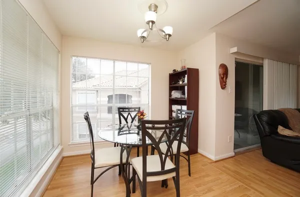 a view of a dining room with furniture window and outside view