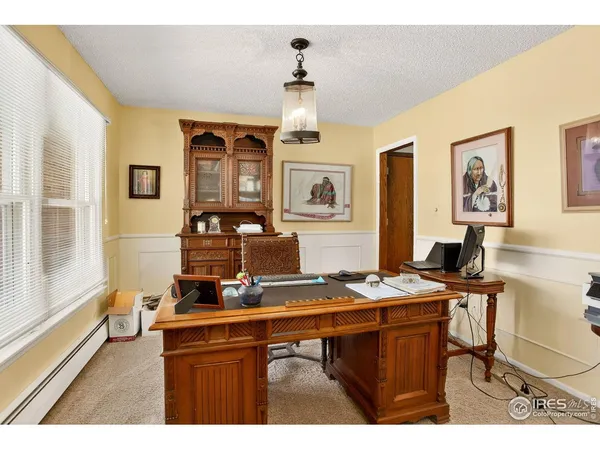 a view of a workspace with furniture