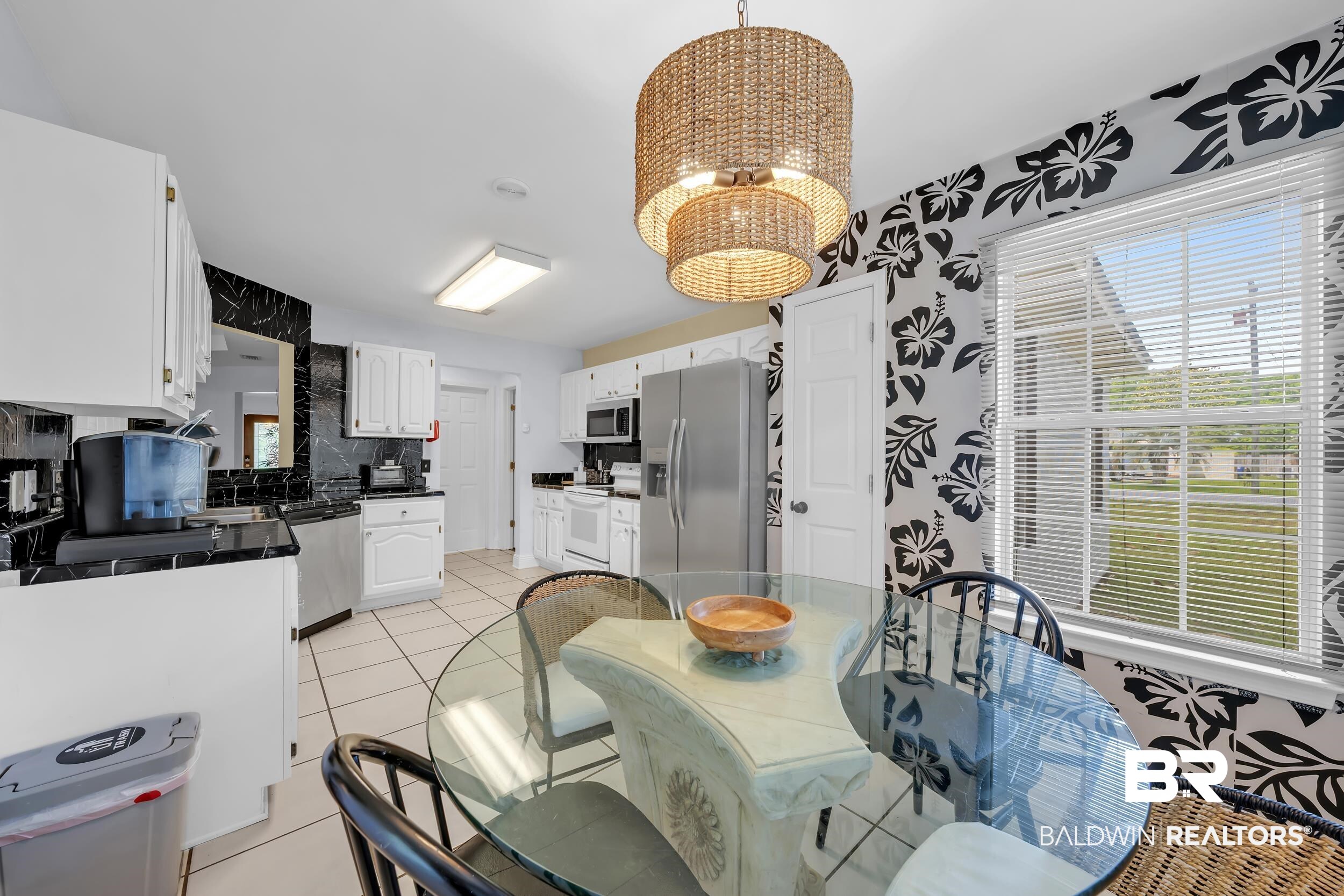 509 Loblolly Court Foley, AL 36535 - Photo 9 of 26 Kitchen dining area featuring a woven pendant light fixture
