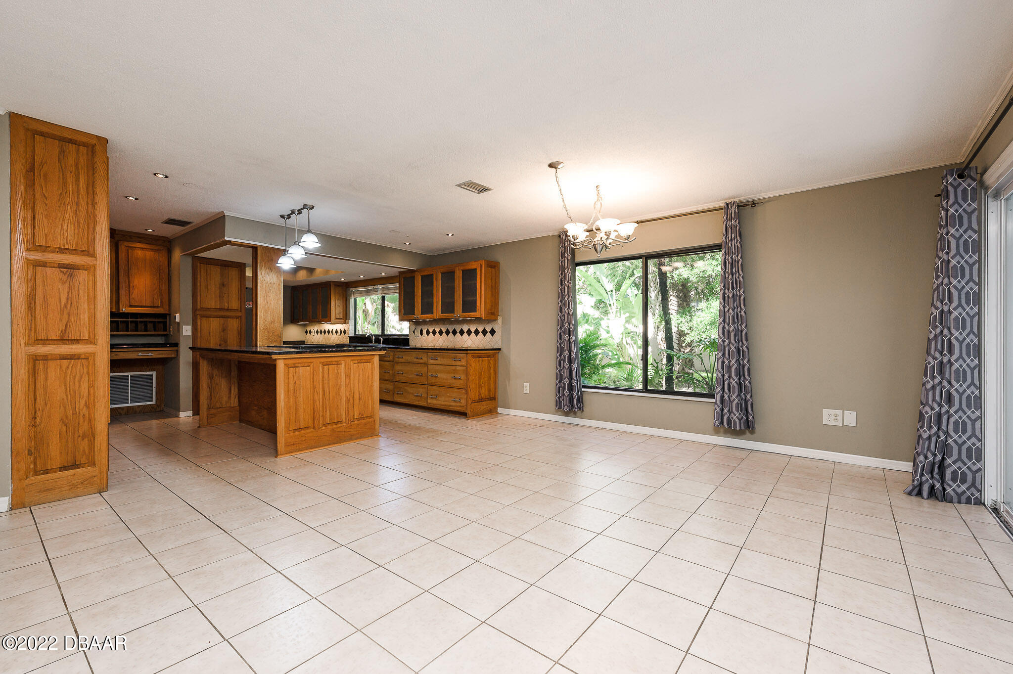 35 Pebble Beach Drive Ormond Beach, FL 32174 - Photo 12 of 45 a view of a kitchen with microwave and furniture