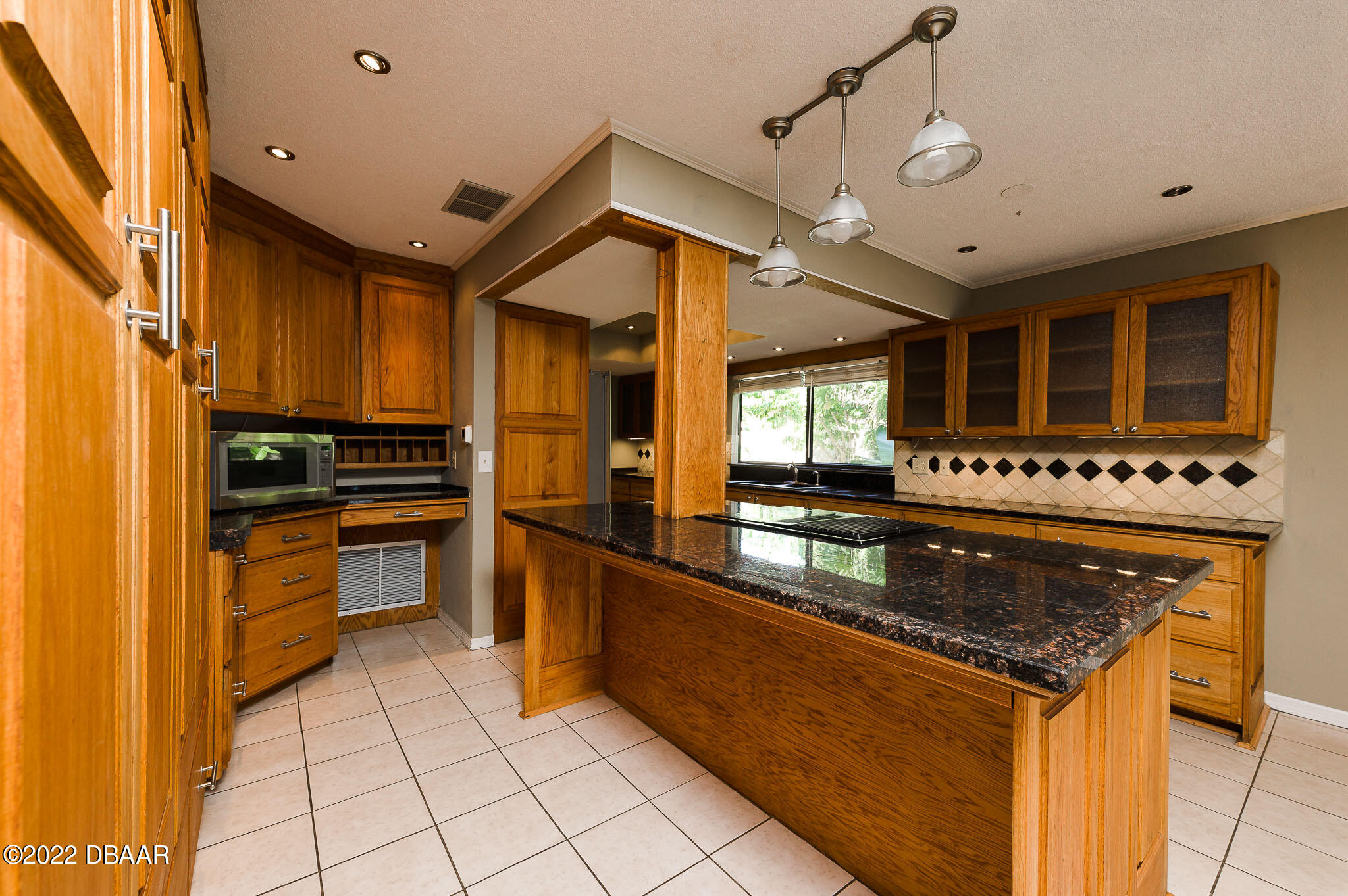 35 Pebble Beach Drive Ormond Beach, FL 32174 - Photo 13 of 45 a kitchen with granite countertop a sink cabinets and stainless steel appliances