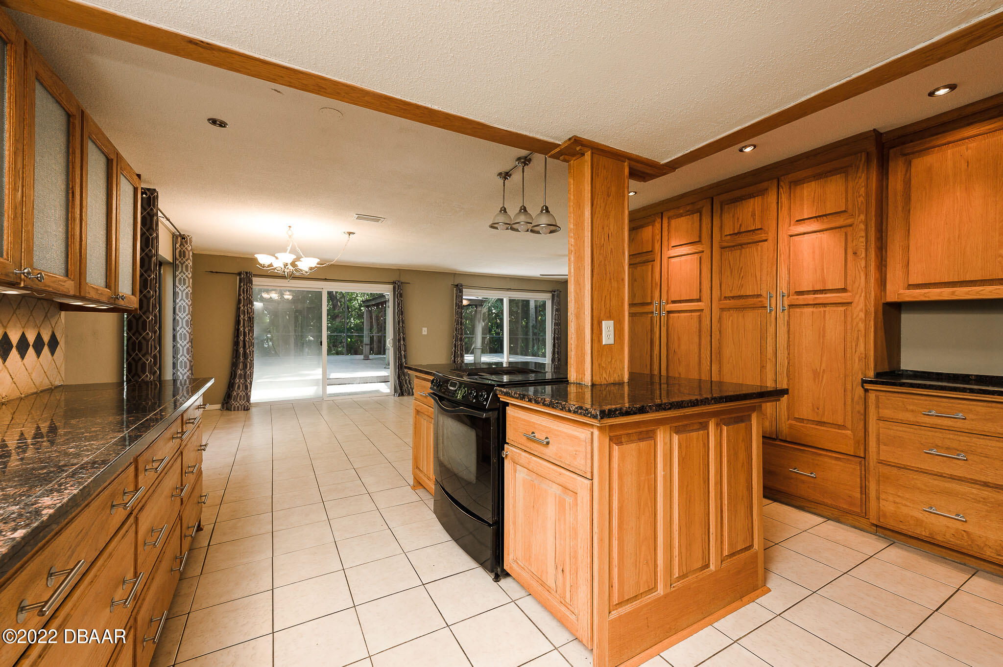 35 Pebble Beach Drive Ormond Beach, FL 32174 - Photo 16 of 45 a kitchen with stainless steel appliances granite countertop a refrigerator and a stove