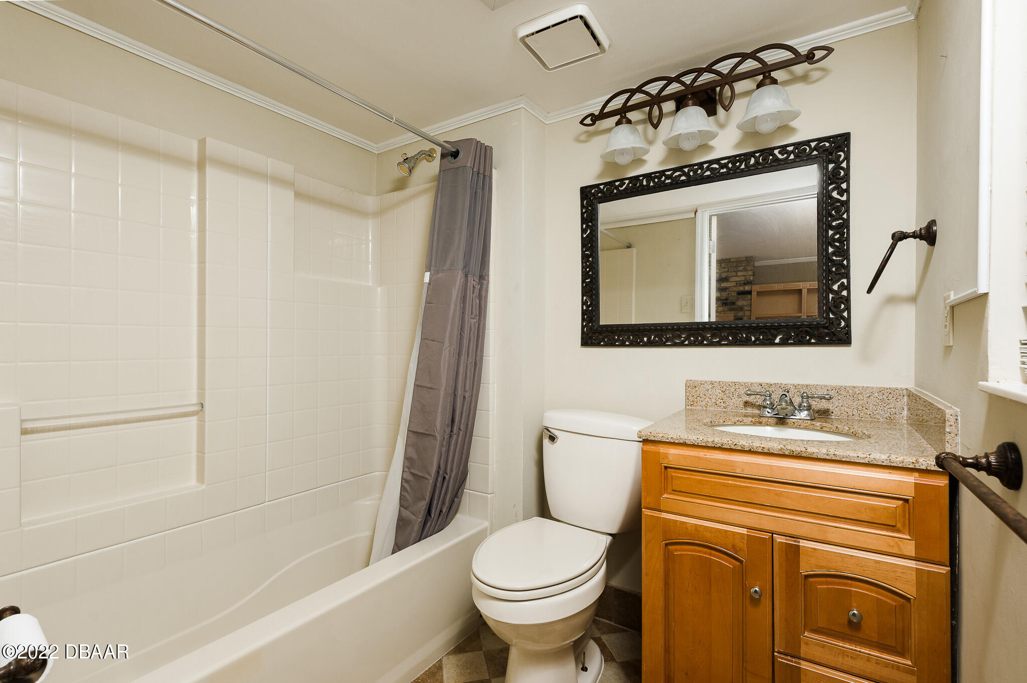 35 Pebble Beach Drive Ormond Beach, FL 32174 - Photo 21 of 45 a bathroom with a toilet sink and mirror