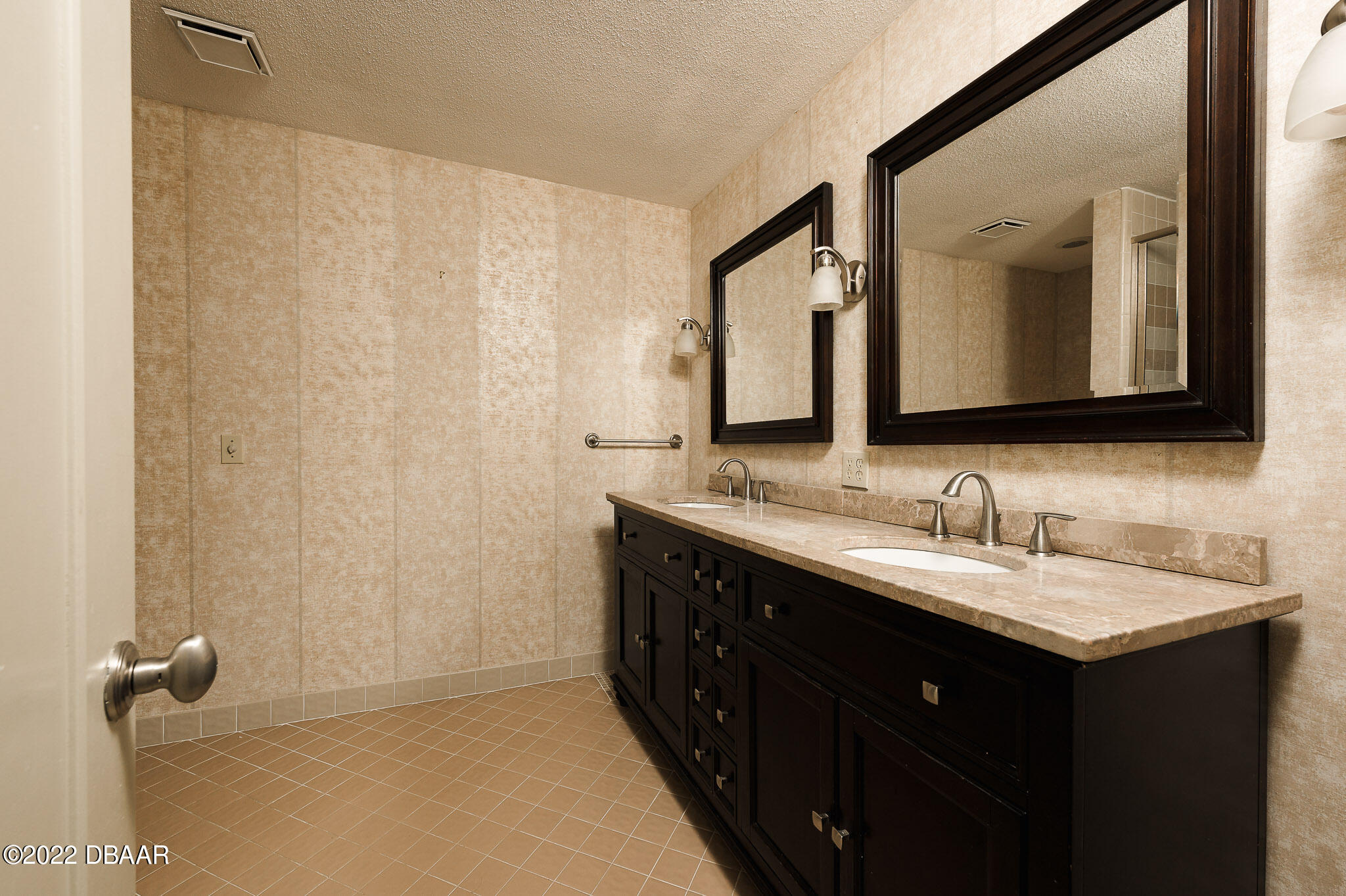 35 Pebble Beach Drive Ormond Beach, FL 32174 - Photo 26 of 45 a bathroom with a double vanity sink and a mirror