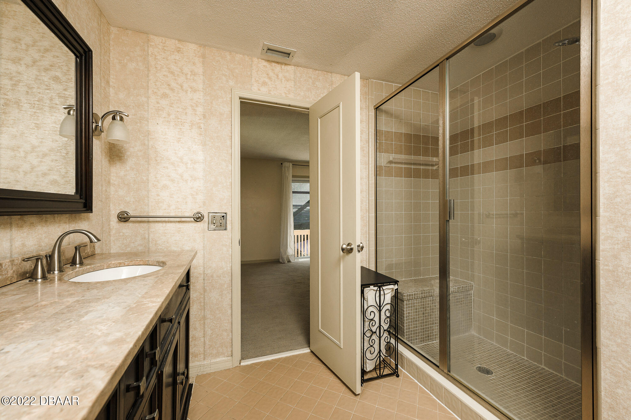35 Pebble Beach Drive Ormond Beach, FL 32174 - Photo 27 of 45 a bathroom with a granite countertop sink a mirror and shower